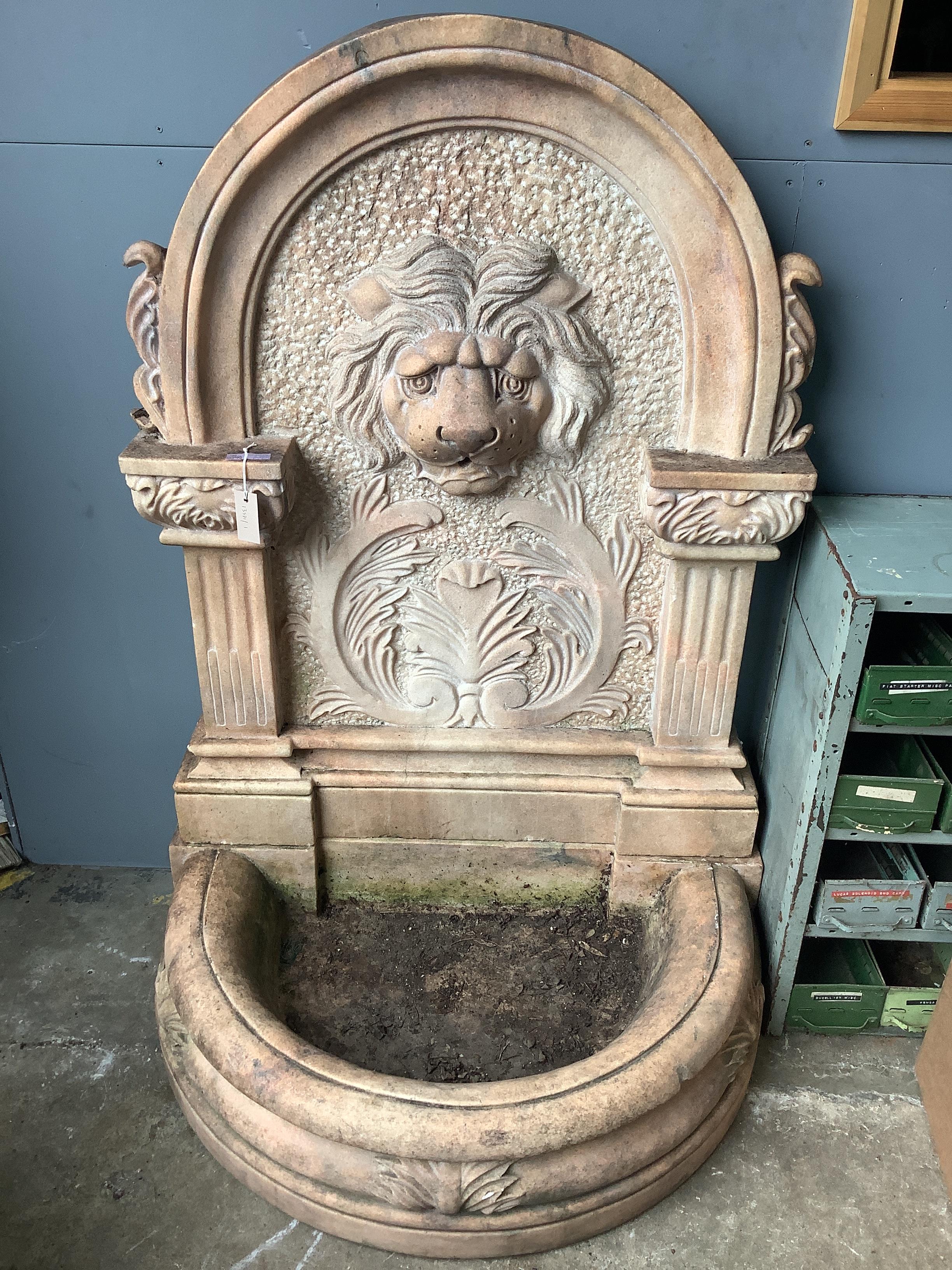 An Italian rose marble garden fountain with lion mask spout, width 94cm, height 135cm